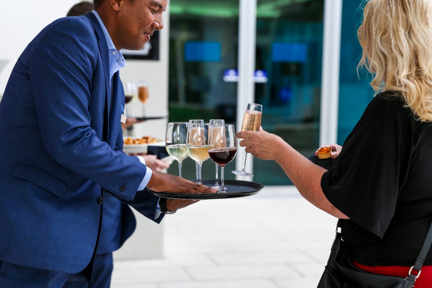 Food and beverage attendant serving drinks at Gold Coast event